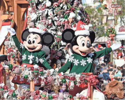  ?? MATT PETIT/DISNEYLAND ?? Mickey and Minnie star in the Christmas Fantasy Parade at Disneyland through Jan. 6.