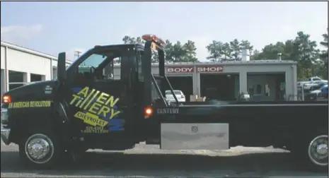  ??  ?? Allen Tillery’s wrecker service provides towing 24/7 by the Allen Tillery Collision paint and body shop.