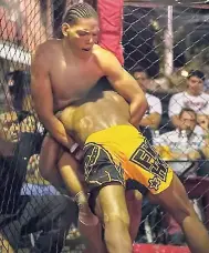  ??  ?? Matthew Colquhoun facing off with an opponent in a recent mixed martial arts fight in Colombia.