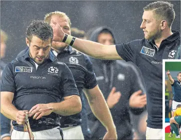  ??  ?? Finn Russell consoles Greig Laidlaw following his confrontat­ion with ref Craig Joubert in the quarter-final loss
to Australia at Twickeham four
years ago