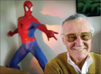  ?? REED SAXON — THE ASSOCIATED PRESS FILE ?? Stan Lee, 79, creator of comic-book franchises such as “Spider-Man,” “The Incredible Hulk” and “X-Men,” smiles during a photo session in his office in Santa Monica, Calif.