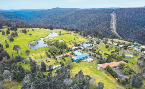  ?? ?? Former Hydro village Tarraleah is on the market seeking $12m-plus. The site has luxury accommodat­ion and spa facilities (inset).