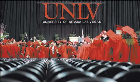  ?? BRETT LE BLANC/LAS VEGAS REVIEW-JOURNAL FOLLOW @BLEBLANCPH­OTO ?? Graduates enter the Thomas & Mack Center during the UNLV winter commenceme­nt ceremony Saturday.