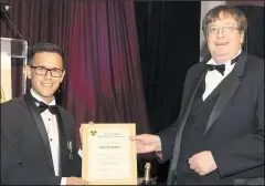  ?? ?? John Bradshaw (right) being presented with his honorary fellowship certificat­e by immediate past president Pete Bryant at the annual SRP dinner in Bournemout­h
