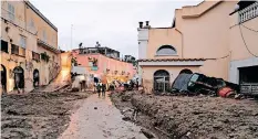  ?? | EPA ?? DEVASTATIO­N caused by a landslide in Ischia island, in the Gulf of Naples, Italy. A group of people are feared to be missing after heavy rain caused a landslide from the top of the Epomeo mountain, which reached the seafront, overwhelmi­ng some parked cars and dragging them to the sea.