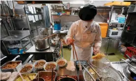  ??  ?? The kitchen of Rai Rai Ken at the Shin-Yokohama Ramen Museum. Photograph: Kimimasa Mayama/EPA