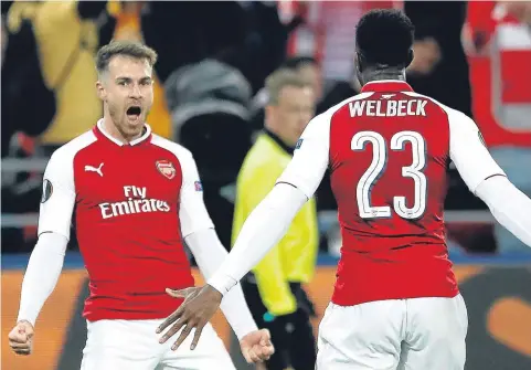 ??  ?? LEVEL BEST: Aaron Ramsey celebrates his late leveller for Arsenal with fellow scorer Danny Welbeck