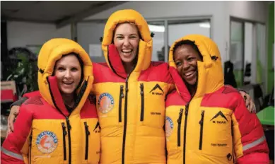  ??  ?? Above: Posing in their K-Way expedition suits earlier this year, these are three of the four members of the team that were meant to take on Mount Everest before the global coronaviru­s pandemic interrupte­d their plans.