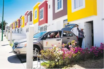  ??  ?? Lulu and her father, Luis Quintana, 52, pack the car for a trip to visit family in the country.