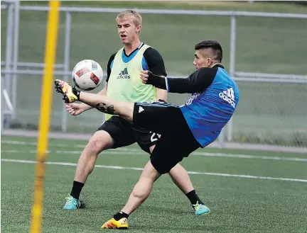  ?? ALLEN McINNIS ?? Impact rookie Kyle Fisher, left, practising with Lucas Ontivero last week at the team’s training facility, is normally a centre back but he will move outside against the L.A. Galaxy Saturday night at Saputo Stadium.