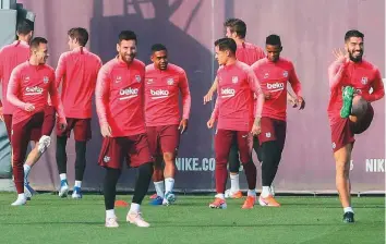  ?? Rex Features ?? Lionel Messi (from left), Philippe Coutinho and Luis Suarez of Barcelona during training session.