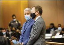  ?? ?? Jeffrey Williams (left), who represents rapper Young Thug, speaks with Tom Clyde, an attorney for The Atlanta Journal-constituti­on and other media outlets, as they wait for the Fulton County Chief Judge Ural Glanville during jury selection on Monday.