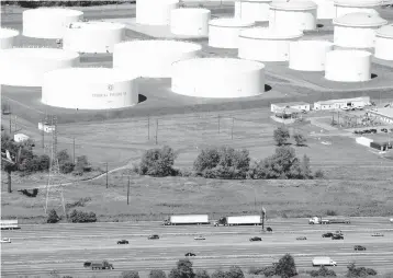  ?? MARK LENNIHAN/AP 2008 ?? Oil storage tanks owned by Colonial Pipeline. The company’s pipelines run from New Jersey to Texas.