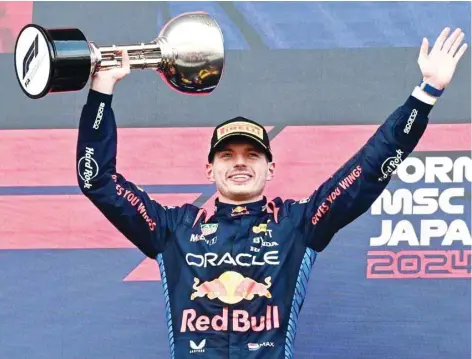  ?? — AFP ?? Max Verstappen celebrates on the podium.