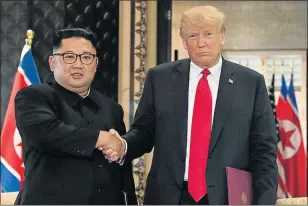  ?? Picture: AFP ?? HISTORIC MEETING: US President Donald Trump, right, and North Korea’s leader Kim Jong Un shake hands following a signing ceremony during their historic US-North Korea summit, at the Capella Hotel on Sentosa island in Singapore yesterday
