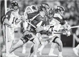  ?? TERRANCE WILLIAMS/CAPITAL GAZETTE ?? Bayhawks attack Lyle Thompson (4) brings the ball across the field during the first quarter against the Lizards at Navy-Marine Corps Memorial Stadium.