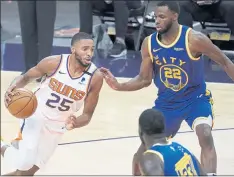  ?? MATT YORK – THE ASSOCIATED PRESS ?? The Warriors’ Andrew Wiggins, right, coming off his best season as a pro, could be effective in a more condensed role such as Suns forward Mikal Bridges.