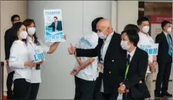  ?? ANDY CHONG / CHINA DAILY ?? Allan Zeman(center), chairman of Lan Kwai Fong Group and an Election Committee member, arrives at the Hong Kong Convention and Exhibition Centre to cast his vote on Sunday.