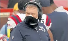  ?? AP FILE ?? Patriots head coach Bill Belichick wears two masks as he watches from the sideline during the first half against the Kansas City Chiefs on Monday night in Kansas City, Mo.
