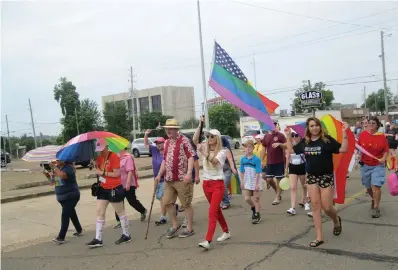  ?? Staff photo by Greg Bischof ?? ■ Songwriter and recording artist Stephanie Rice, a Texarkana native, leads the second annual Day of Pride Parade on Saturday in downtown Texarkana. Equality Texarkana planned both the parade and the musical festival.