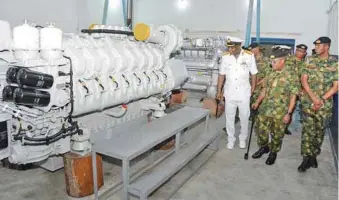  ??  ?? The Chief Naval Staff, Vice Admiral Ibok-Ete Ibas inspecting the MTU Engines Training Centre at Nigerian Navy Engineerin­g College Sapele....recently