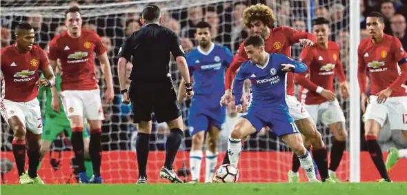  ?? AP PIC ?? Chelsea’s Eden Hazard controls the ball during their FA Cup quarter-final match against Manchester United on March 13.