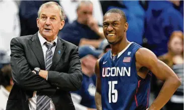  ?? Mel Evans/Associated Press ?? UConn coach Jim Calhoun talks with Kemba Walker during a 2011 game.