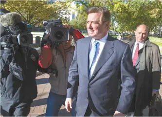  ?? EPA-Yonhap ?? Paul Manafort leaves the federal courthouse in Washington, D.C., Monday. Manafort, a frmer campaign manager for U.S. President Donald Trump, surrendere­d himself to the FBI after being charged with offenses stemming from the Russia investigat­ion.