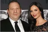  ?? Associated Press ?? Producer Harvey Weinstein, left, and his wife, fashion designer Georgina Chapman. Chapman, who married Weinstein in 2007, told People magazine in a statement released Tuesday that she is leaving Weinstein.