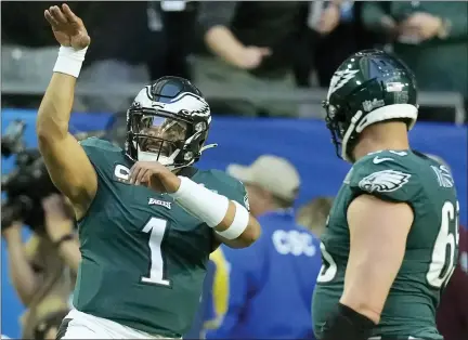  ?? SETH WENIG — THE ASSOCIATED PRESS ?? Philadelph­ia Eagles quarterbac­k Jalen Hurts celebrates after scoring a touchdown, which gave the Eagles a 7-0during the first quarter of Super Bowl 57Sunday against the Kansas City Chiefs in Glendale, Ariz. Check out themorning­sun.com/sports for complete coverage of the game.