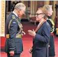  ??  ?? Davies being knighted by the Prince of Wales earlier this month