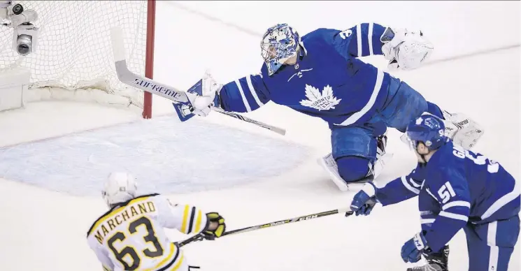  ?? PETER J. THOMPSON ?? Maple Leafs goalie Frederik Andersen dives in vain as Boston’s Brad Marchand scores in a 3-1 Bruins victory in Game 4 Thursday at the Air Canada Centre in Toronto.