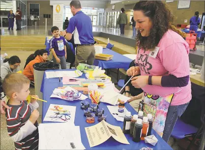  ??  ?? Piccowaxen Middle School art teacher Gayle Kraus, right, works with Maddox Yates, a prekinderg­arten student who attends Archbishop Neal School, on a Hands-On S.T.E.A.M. Activity at the first Charles County Public Schools History, Industry, Technology...