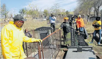  ?? Picture: ZIYANDA ZWENI ?? WALK THE TALK: ANC members led by provincial secretary Lulama Ngcukaitob­i cleaned gravesites of fallen party members in Mthatha on Saturday.