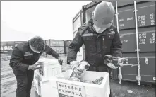  ?? PROVIDED TO CHINA DAILY ?? Left: Workers pack fresh vegetables in Weifang, Shandong province, for delivery to Wuhan, Hubei province. Wuhan. Right: Workers load winter melons for Hubei at Nanning Railway Station, Guangxi.