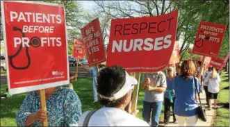  ?? EVAN BRANDT — DIGITAL FIRST MEDIA ?? Picketers in front Pottstown Hospital Tuesday, May 8, chanted “1, 2, 3, 4, safe staffing on the floor, 5, 6, 7, 8, Tower must negotiate.”