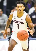  ?? Stephen Dunn / Associated Press ?? Christian Vital scored 15 of his 17 points in the second half of UConn’s seasonopen­ing win over Sacred Heart on Friday.