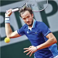  ?? ?? Russia’s Daniil Medvedev returns the ball to Argentina’s Facundo Bagnis. Medvedev won in straight sets