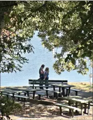  ?? (Special to the DemocratGa­zette/Marcia Schnedler) ?? A public display of affection brightens a fall day near Lake Ouachita’s shore.