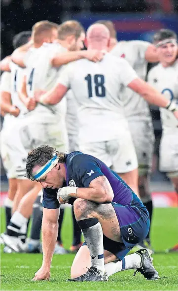  ??  ?? DEJECTION: Hamish Watson can’t believe it as England celebrate their late, late try during the last Calcutta Cup clash at Twickenham – the thrilling 38-38 draw in 2019.