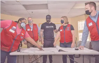  ?? PHOTO COURTESY OF LOWE’S ?? Country star Kane Brown, center, is shown during a previous visit to the Lowe’s in Hixson, where he used to work. As part of its centennial celebratio­n, Lowe’s is helping to remodel, renovate or revitalize recreation centers, parks and playground­s in 100 communitie­s across the country.