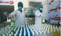  ?? (Abed Rahim Khatib/Flash90) ?? WORKERS MAKE hand sanitizer gel on Sunday at a factory in Khan Yunis, in the Gaza Strip.