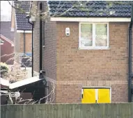  ??  ?? LOCKED DOWN Cops seal off quiet street in Dundee and remove car from house as part of murder investigat­ion