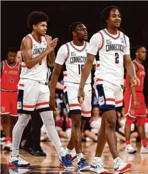  ?? Sarah Stier/Getty Images ?? UConn’s Tristen Newton (2), Hassan Diarra (10), Jaylin Stewart (3) and the top-seeded Huskies will open NCAA Tournament play against Stetson on Friday.