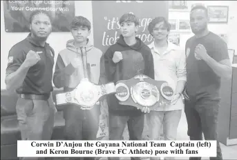  ?? ?? Corwin D’Anjou the Guyana National Team Captain (left) and Keron Bourne (Brave FC Athlete) pose with fans