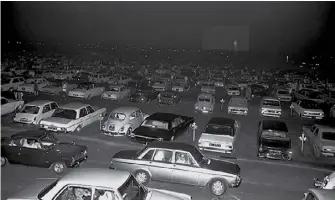  ?? ?? (Middle) Vehicles at the Jurong Drive-in Cinema on opening night, 14 July 1971. Ministry of Informatio­n and the Arts Collection, courtesy of National Archives of Singapore.