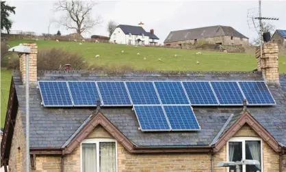  ?? Photograph: Jeff Morgan 10/Alamy ?? During sunny spells when homes generate more electricit­y from solar panels than required they can store it to use later or supply the energy system.