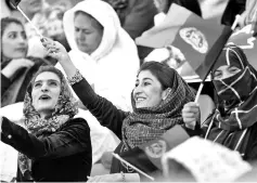  ??  ?? In this photograph taken on September 21, 2017, Afghan football fans watch a Roshan Afghan premiere league match between Toofan Harirod and Simorgh Alborz at the Afghanista­n Football Federation (AFF) stadium in Kabul. A cross section of women...