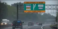  ?? MATT SLOCUM — ASSOCIATED PRESS ?? This photo from Friday July 31, 2020, shows toll signage as motorists travel along the New Jersey Turnpike in Carneys Point, N.J.