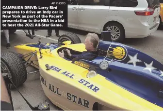  ?? AP PHOTO ?? CAMPAIGN DRIVE: Larry Bird prepares to drive an Indy car in New York as part of the Pacers’ presentati­on to the NBA in a bid to host the 2021 All-Star Game.